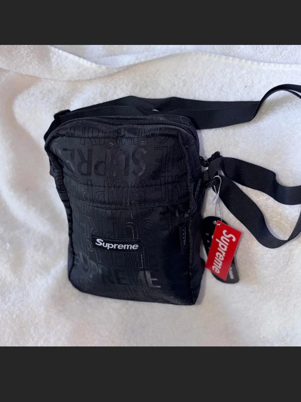 Supreme Black Embossed Logo Shoulder Bag with Red Tag
